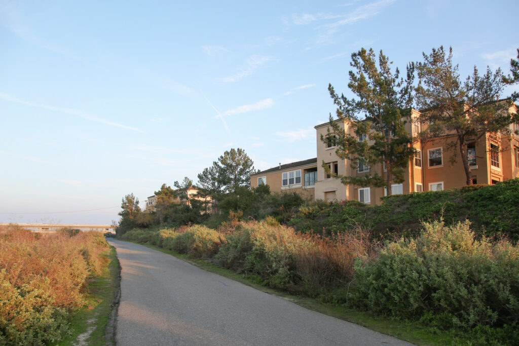 Open trail next to apartment