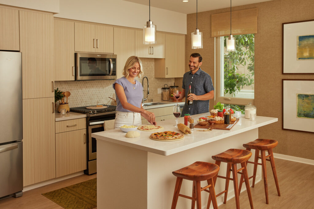 Couple in apartment kitchen making a meal