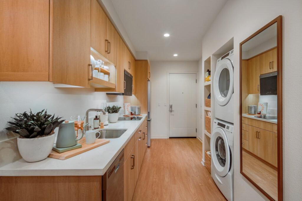 Interior view of Meridian Apartment home with kitchen, washer, and dryer