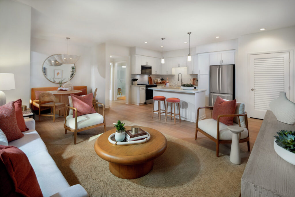 Interior view of living room and kitchen amenities at the new phase of Avella Apartment Home