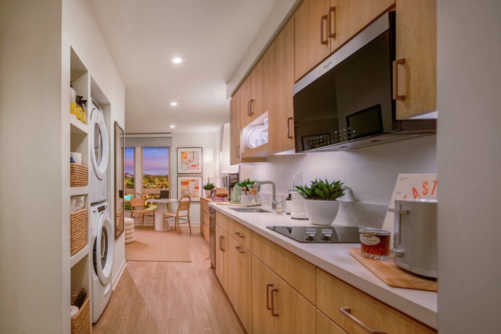 Interior view of kitchen amenities in Studio unit at Pacifica Place Apartment Community.